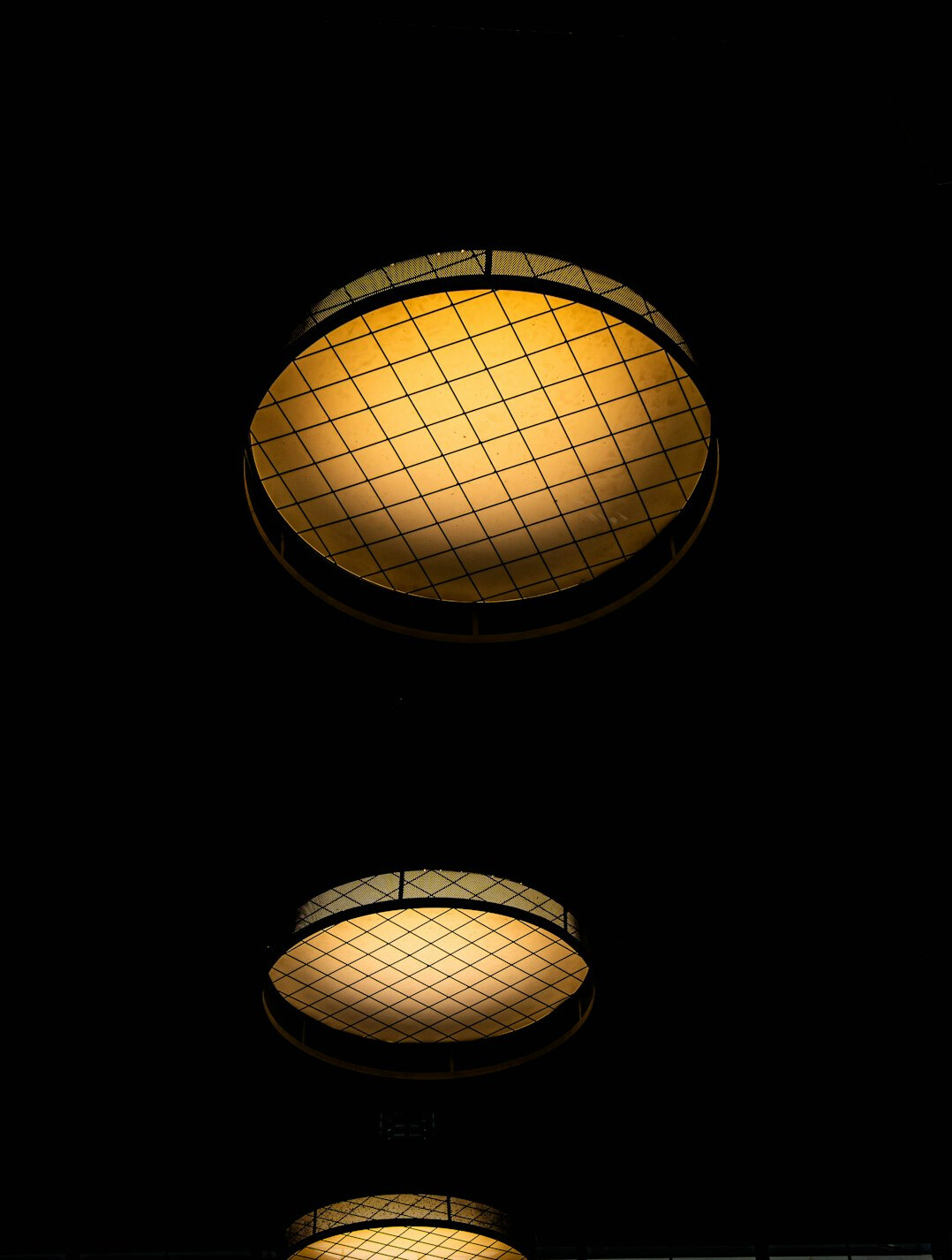 Studio lighting rig with softboxes hanging from a grid
